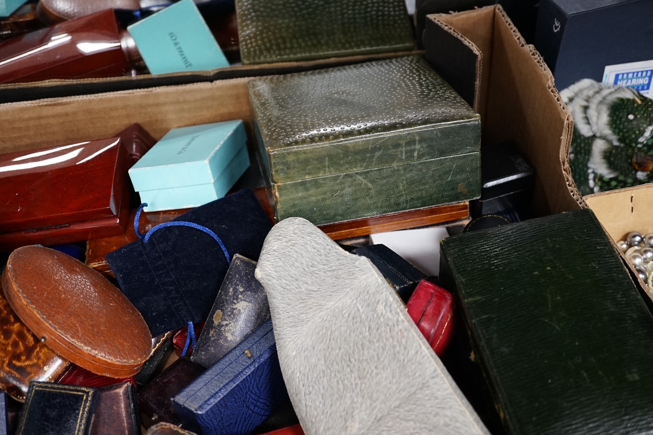 A large quantity of mixed jewellery boxes together with a larger jewellery box.